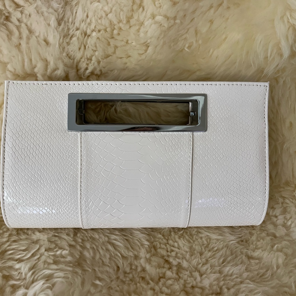 White faux leather clutch—can also be a shoulder bag